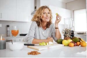 A woman eats healthy fruits to relieve constipation