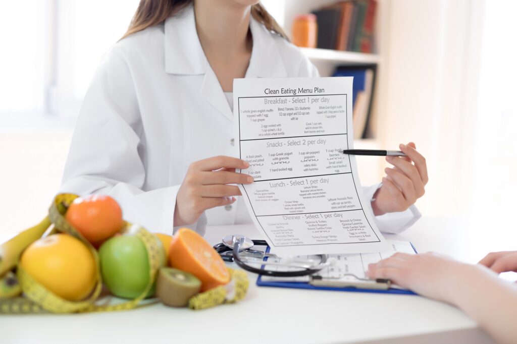 Nutritionist holding a Clean Eating Menu Plan